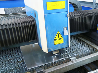 Laser cutter runs specification-cutting of the boards